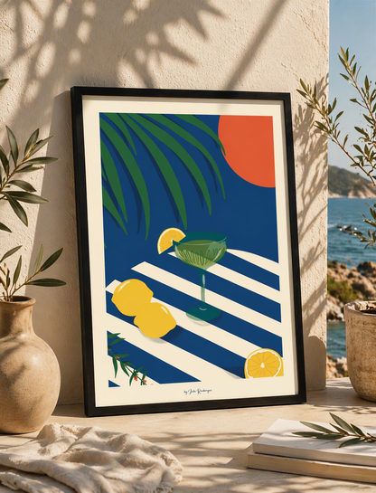 Affiche Apéritivo encadrée en noir posée en extérieur dans une ambiance méditerranéenne avec vue sur la mer et feuillages.